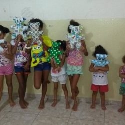 The law prohibits us from showing kids faces. Here they happily received a toy gift.