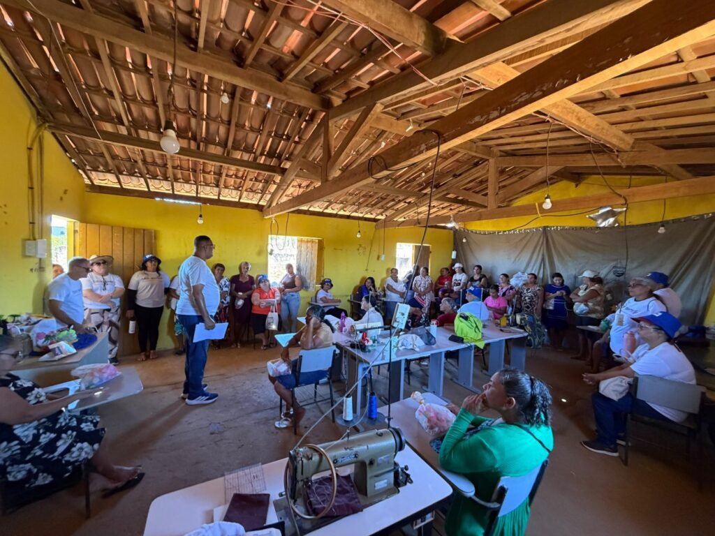 Women of the SOS Sertão sewing and handicraft cooperative gather in their workshop.